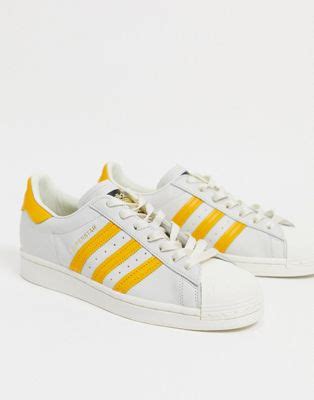 adidas schuh weiss gelbe streifen|Superstar – Sneaker in Weiß mit gelben Streifen .